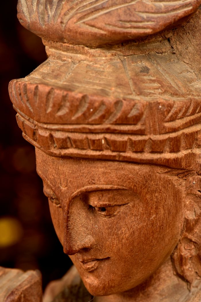 creative Detailed close-up of a traditional Indian wooden sculpture, showcasing intricate craftsmanship.